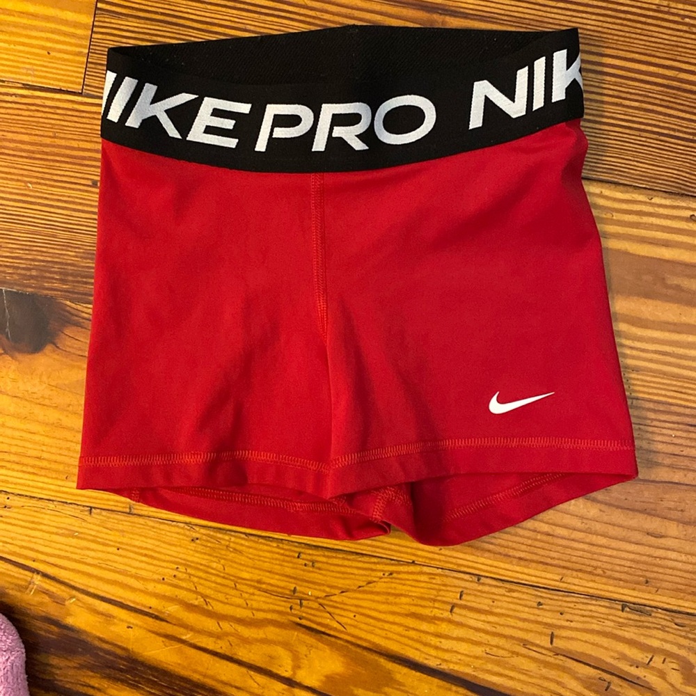 Red Nike pros. Size women’s extra small.